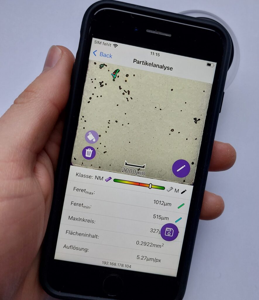 Phone with PartikelLens app to analyze and inspect critical particles